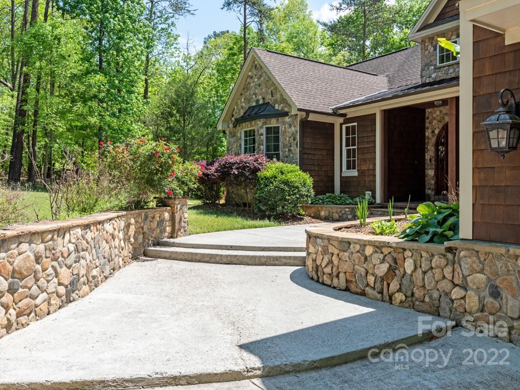 2367 Vineyard Road Fort Mill, SC 29708 - Photo 2 of 39 a front view of a house with a garden