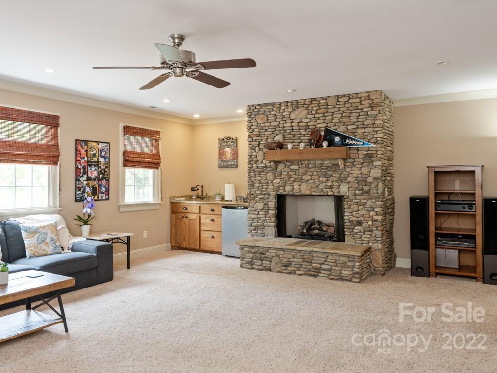 2367 Vineyard Road Fort Mill, SC 29708 - Photo 22 of 39 a living room with furniture and a fireplace