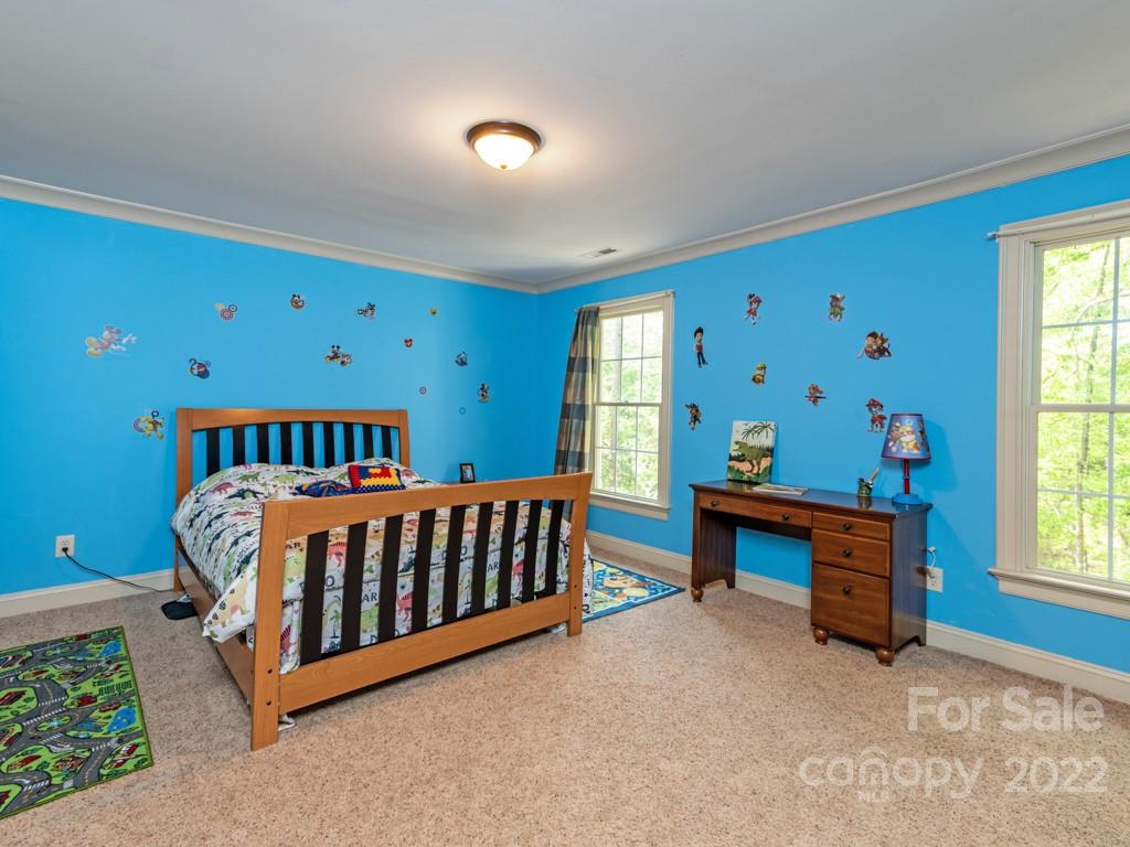 2367 Vineyard Road Fort Mill, SC 29708 - Photo 28 of 39 a bed sitting in a bedroom next to a window