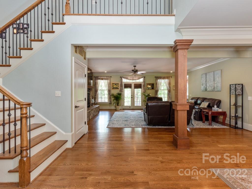 2367 Vineyard Road Fort Mill, SC 29708 - Photo 4 of 39 a view of a hallway with dining room and wooden floor