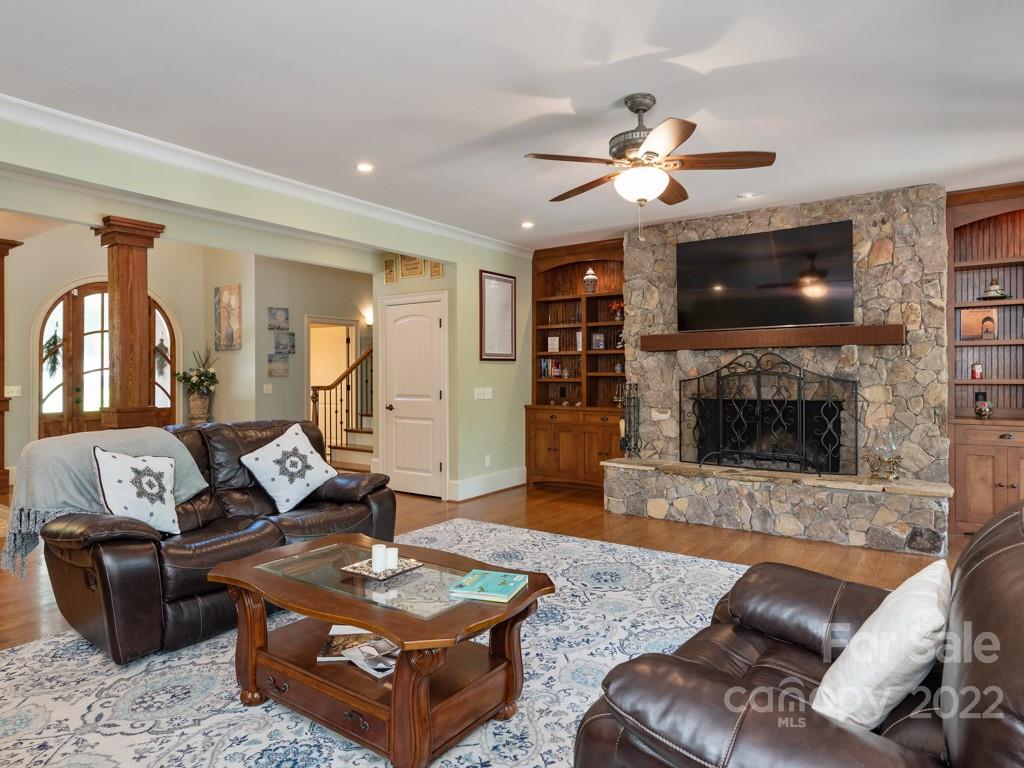 2367 Vineyard Road Fort Mill, SC 29708 - Photo 6 of 39 a living room with furniture a flat screen tv and a fireplace