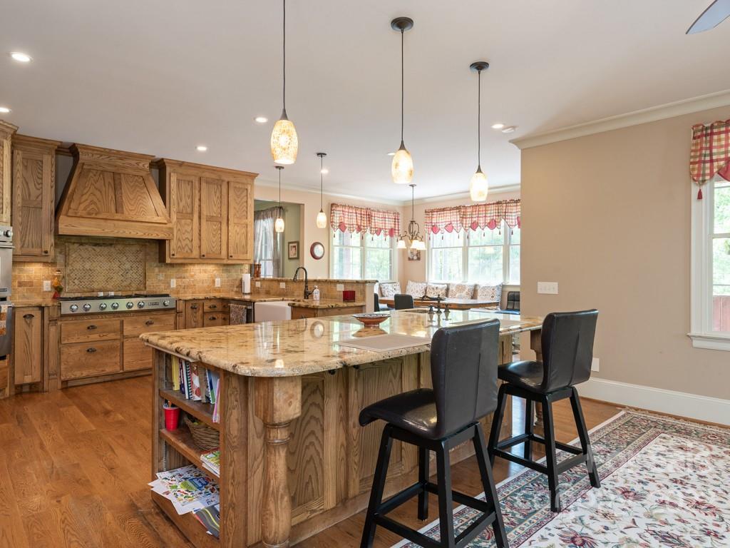 2367 Vineyard Road Fort Mill, SC 29708 - Photo 8 of 39 a kitchen with stainless steel appliances granite countertop a sink a stove and a refrigerator