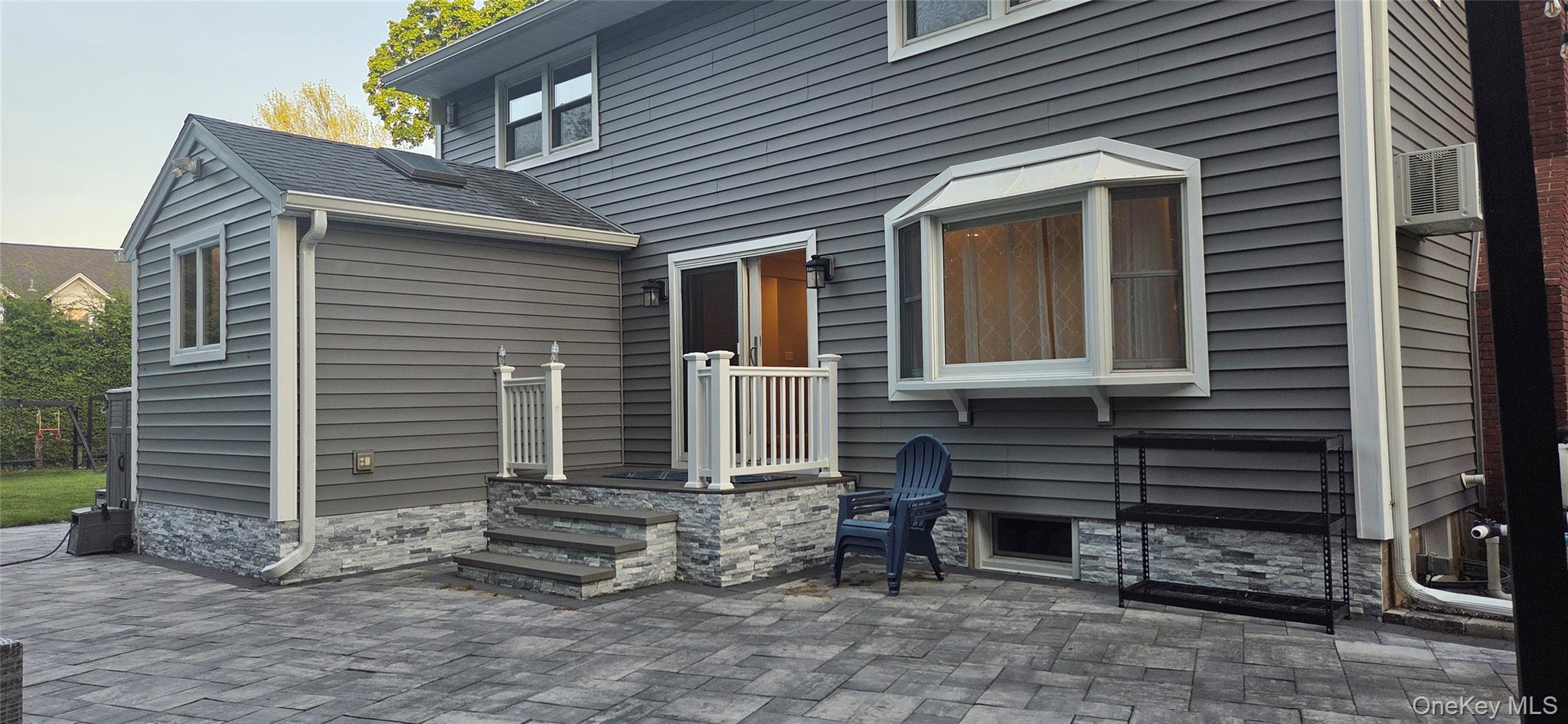 522 Moriches Road St. James, NY 11780 - Photo 42 of 49 a front view of a house with a yard