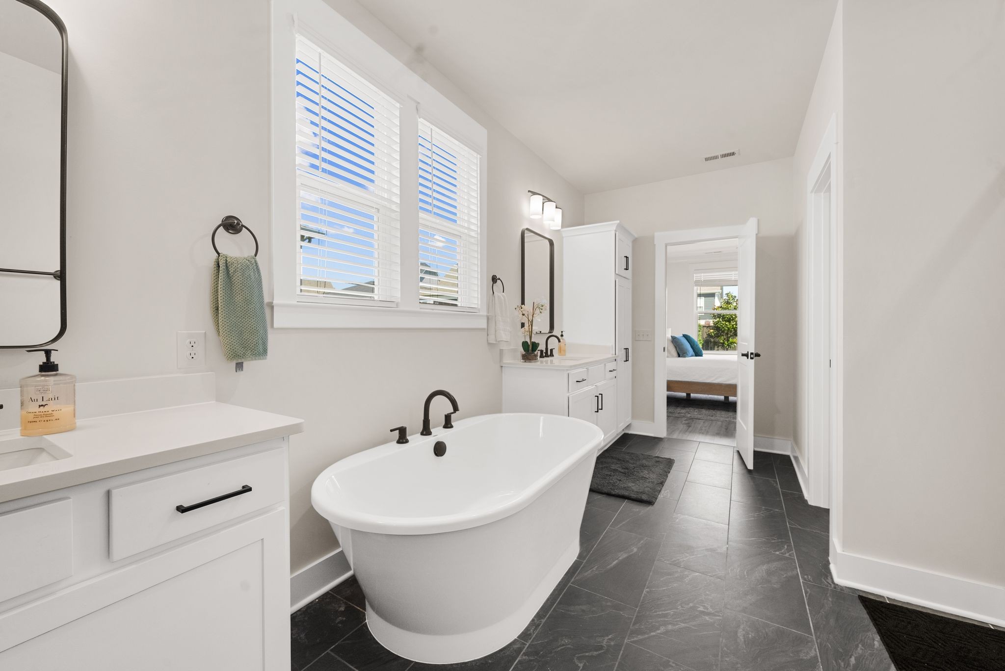 4043 John Marsh Road Spring Hill, TN 37174 - Photo 39 of 56 a bathroom with a sink and a mirror