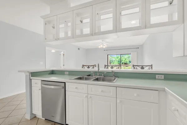 a kitchen with a sink and cabinets