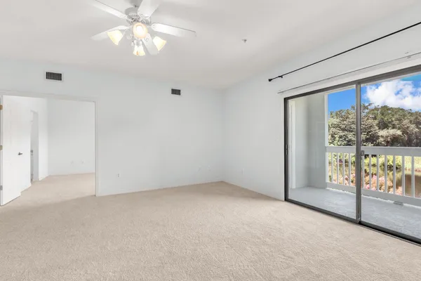 a view of an empty room with a window