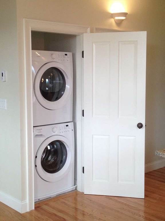 191 Main Street, Unit 2B Gloucester, MA 01930 - Photo 13 of 20 a view of a hallway with washer and dryer