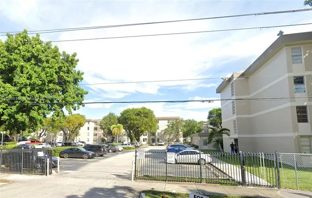 a view of a street with cars