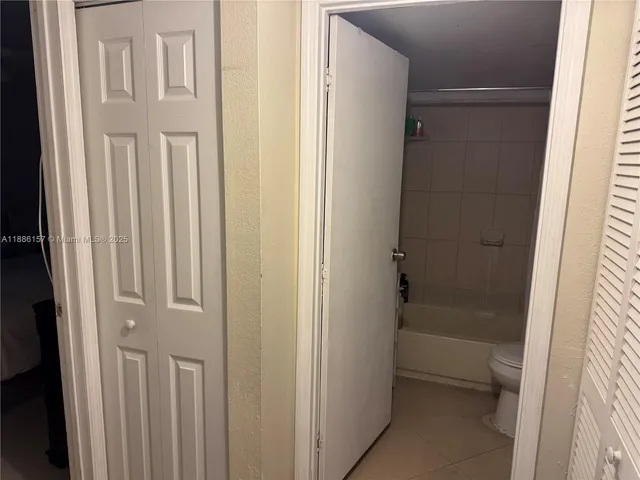 a bathroom with a glass door door