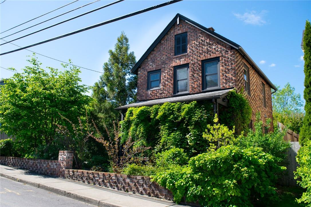 a view of a house with a tree