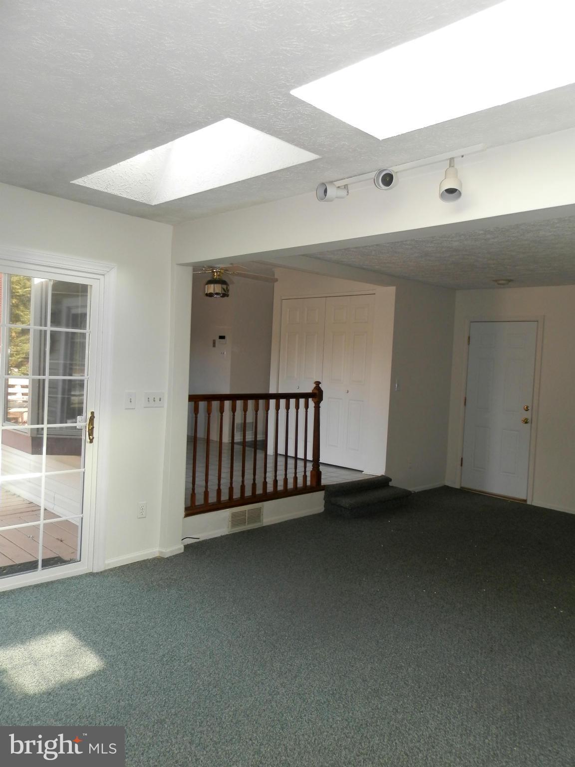 8624 Sherington Road Baltimore, MD 21236 - Photo 13 of 30 Family Room with Two Skylights