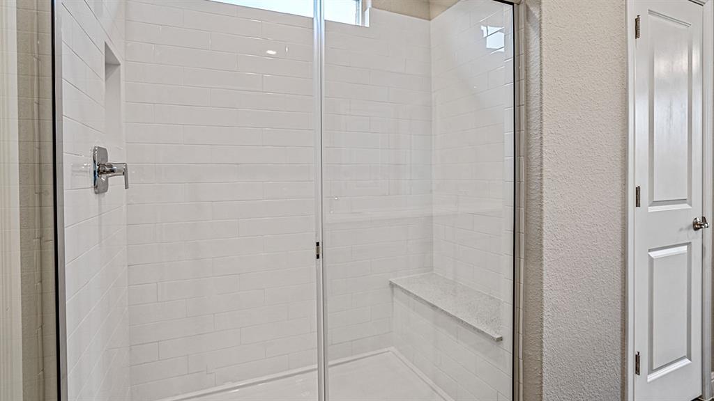 105 Hugo Court Rhome, TX 76078 - Photo 17 of 40 a bathroom with a shower