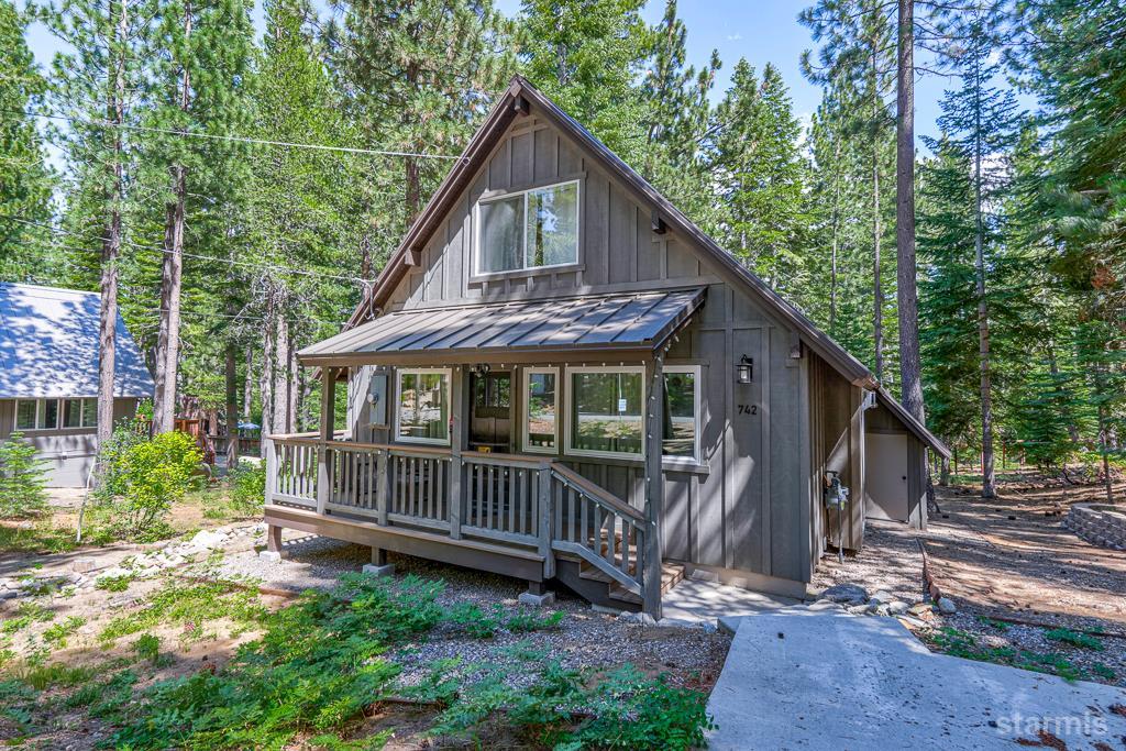 742 Kiowa Drive South Lake Tahoe, CA 96150 - Photo 1 of 26 a view of a house with a yard and a wooden deck