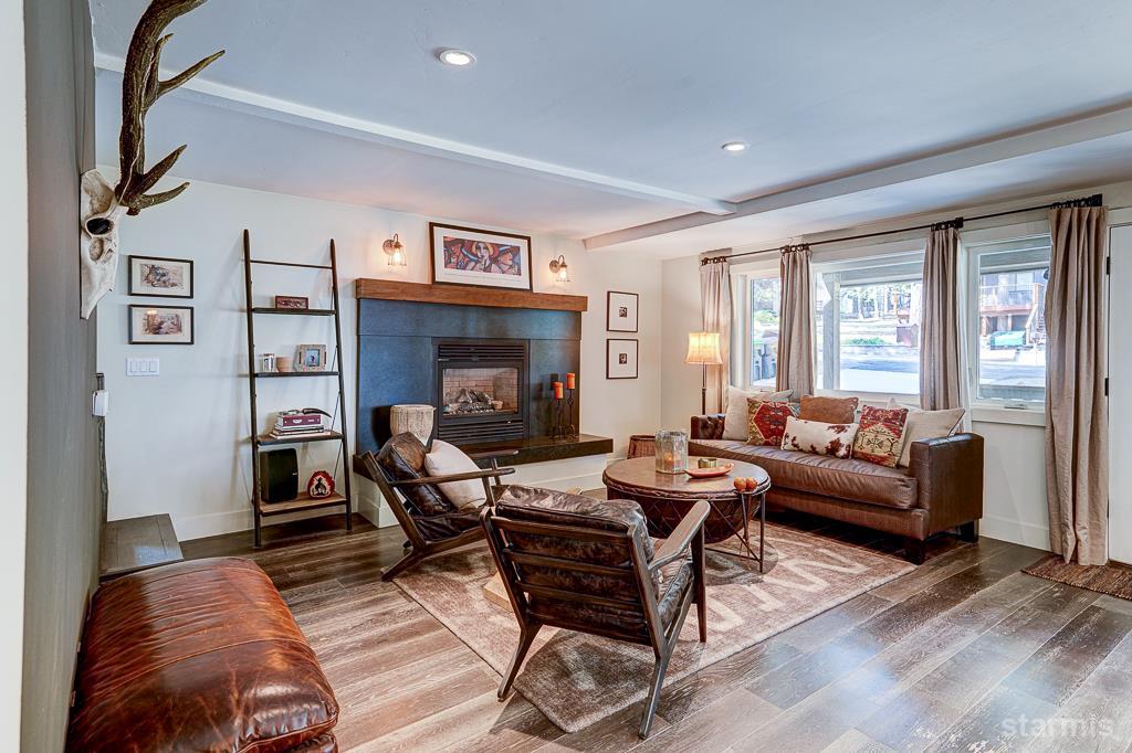 742 Kiowa Drive South Lake Tahoe, CA 96150 - Photo 11 of 26 a living room with furniture and a fireplace