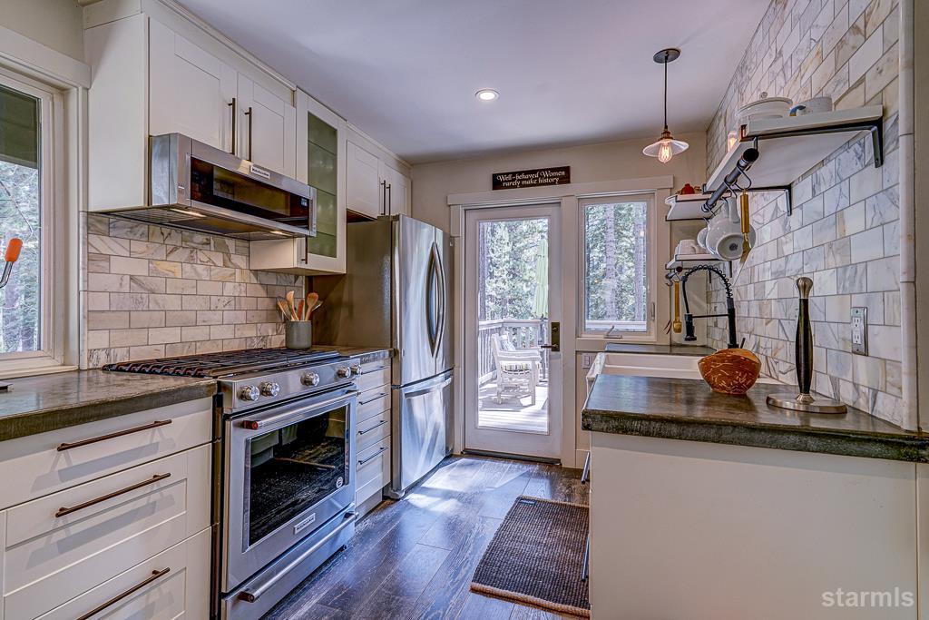 742 Kiowa Drive South Lake Tahoe, CA 96150 - Photo 13 of 26 a kitchen with refrigerator a stove a sink and a microwave