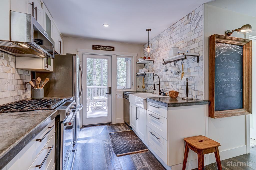 742 Kiowa Drive South Lake Tahoe, CA 96150 - Photo 14 of 26 a kitchen with stainless steel appliances granite countertop a stove and a refrigerator