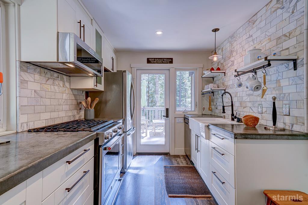 742 Kiowa Drive South Lake Tahoe, CA 96150 - Photo 15 of 26 a kitchen with stainless steel appliances a stove a sink and a refrigerator