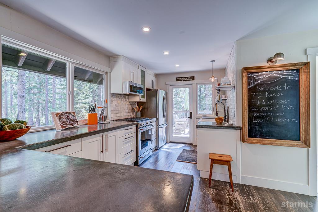 742 Kiowa Drive South Lake Tahoe, CA 96150 - Photo 16 of 26 a kitchen with stainless steel appliances granite countertop a refrigerator and a stove top oven