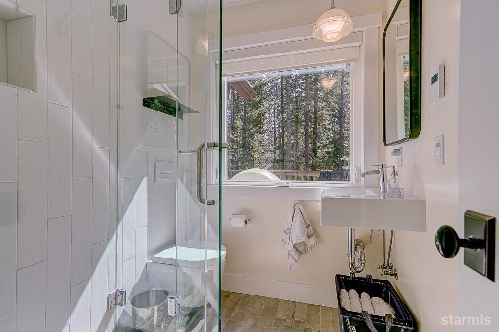 742 Kiowa Drive South Lake Tahoe, CA 96150 - Photo 18 of 26 a bathroom with a bathtub and window