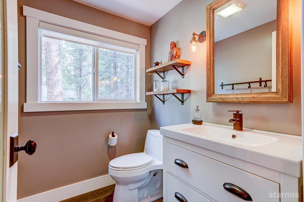 742 Kiowa Drive South Lake Tahoe, CA 96150 - Photo 20 of 26 a bathroom with a sink a toilet and a mirror