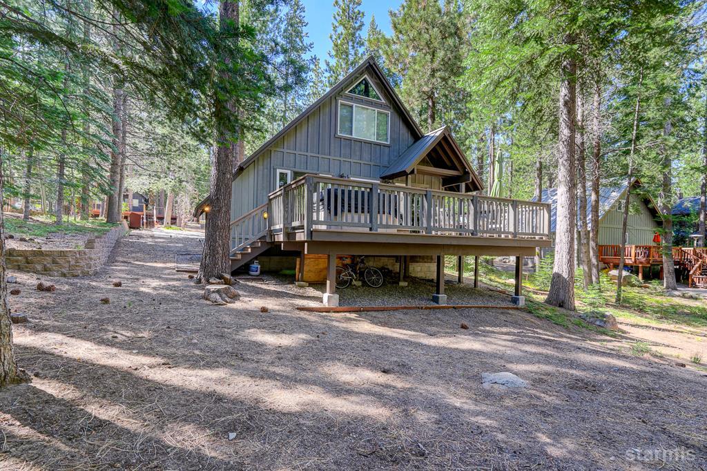 742 Kiowa Drive South Lake Tahoe, CA 96150 - Photo 24 of 26 a view of a house with a yard and large trees