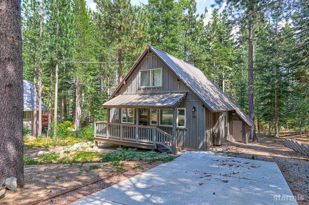 742 Kiowa Drive South Lake Tahoe, CA 96150 - Photo 3 of 26 a front view of a house with a garden