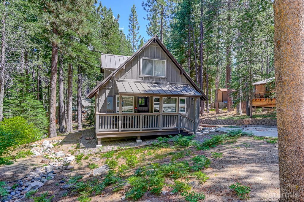 742 Kiowa Drive South Lake Tahoe, CA 96150 - Photo 4 of 26 a house with trees in the background