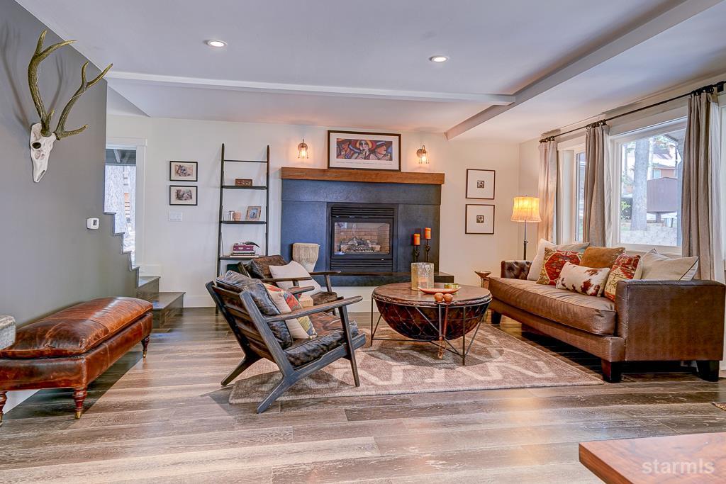 742 Kiowa Drive South Lake Tahoe, CA 96150 - Photo 8 of 26 a living room with furniture and a fireplace