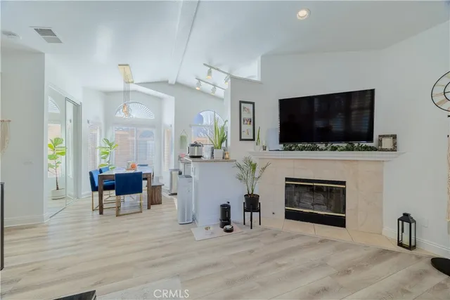 a kitchen with a table chairs stove and cabinets