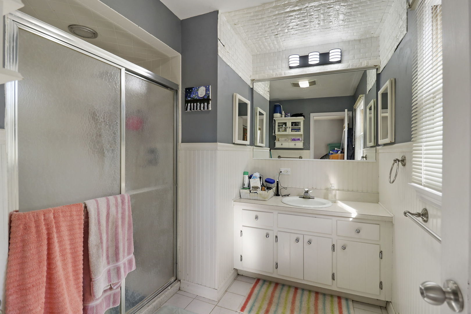 307 South Wulff Street Cary, IL 60013 - Photo 18 of 35 a bathroom with a sink vanity and mirror