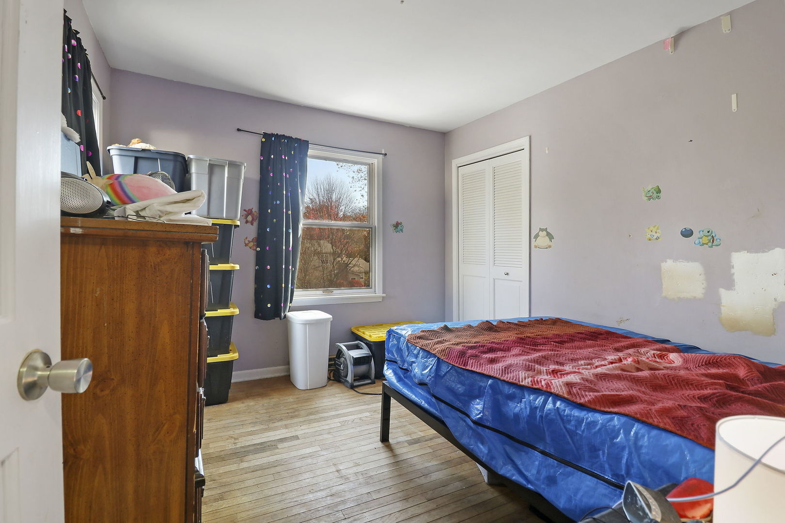 307 South Wulff Street Cary, IL 60013 - Photo 23 of 35 a bedroom with a bed and wooden floor