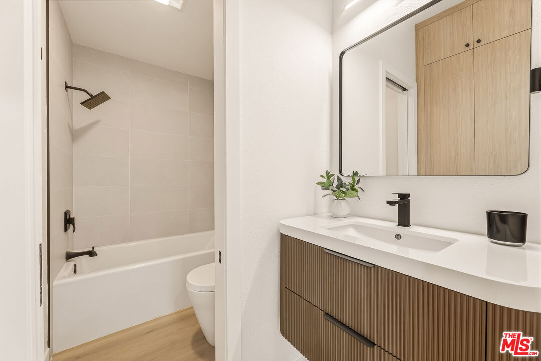 311 Bora Bora Way, Unit 3207 Marina del Rey, CA 90292 - Photo 36 of 54 a bathroom with a sink a toilet and shower