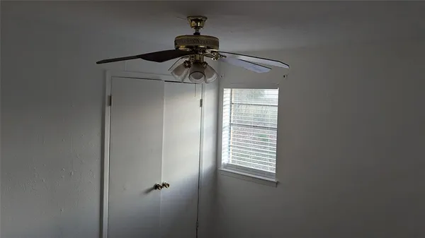 a picture of a glass door with a fan