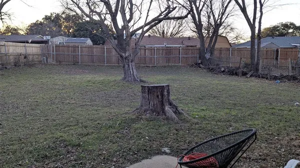 a backyard of a house with lots of green space