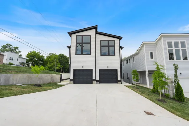 a view of house with yard and street