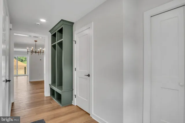a view of hallway with wooden floor