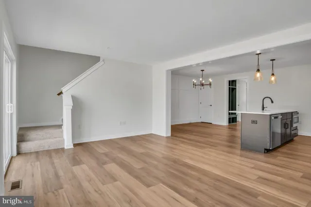 a view of a kitchen with wooden floor
