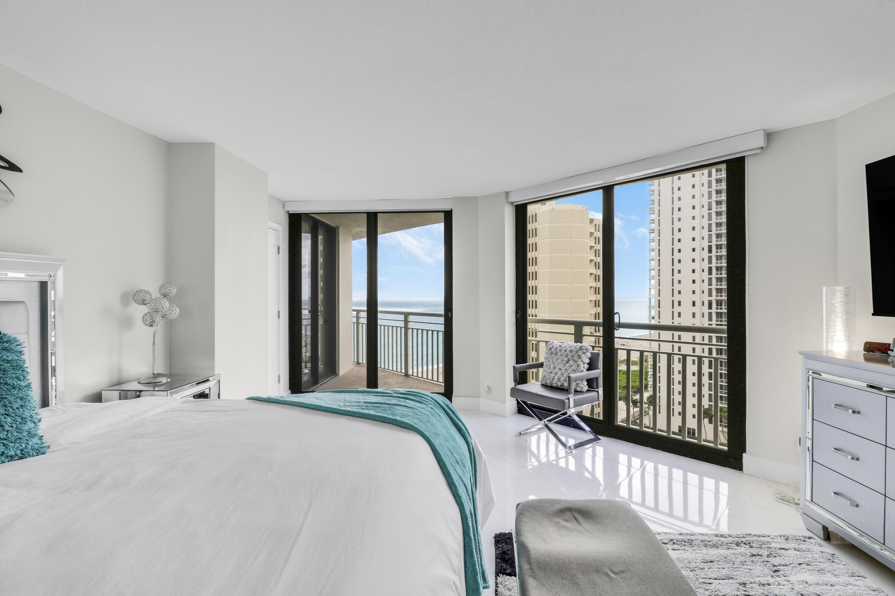 3000 North Ocean Drive, Unit 19H Singer Island, FL 33404 - Photo 26 of 43 a bedroom with a bed and a large window