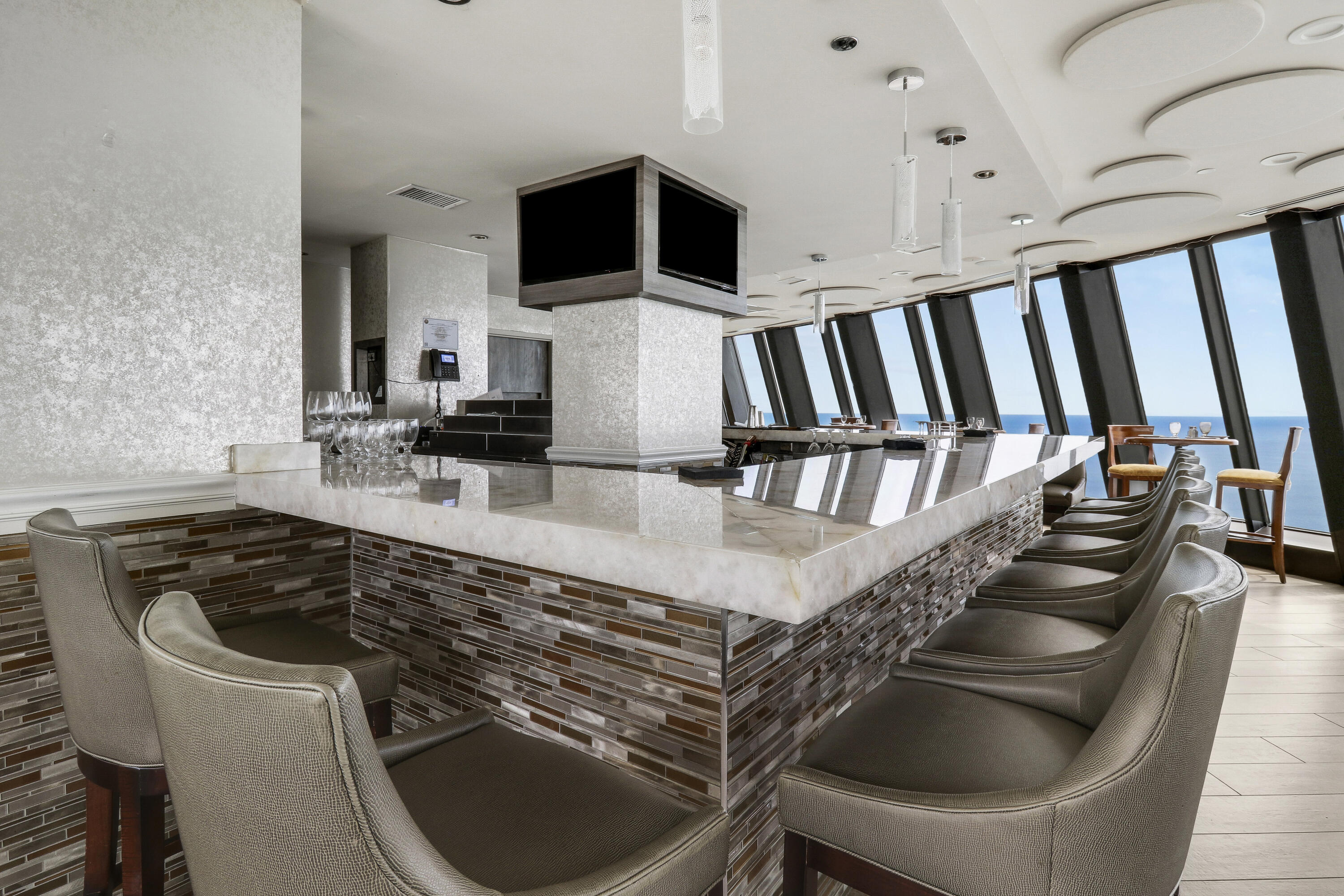 3000 North Ocean Drive, Unit 19H Singer Island, FL 33404 - Photo 38 of 43 a kitchen with a stove and a sink