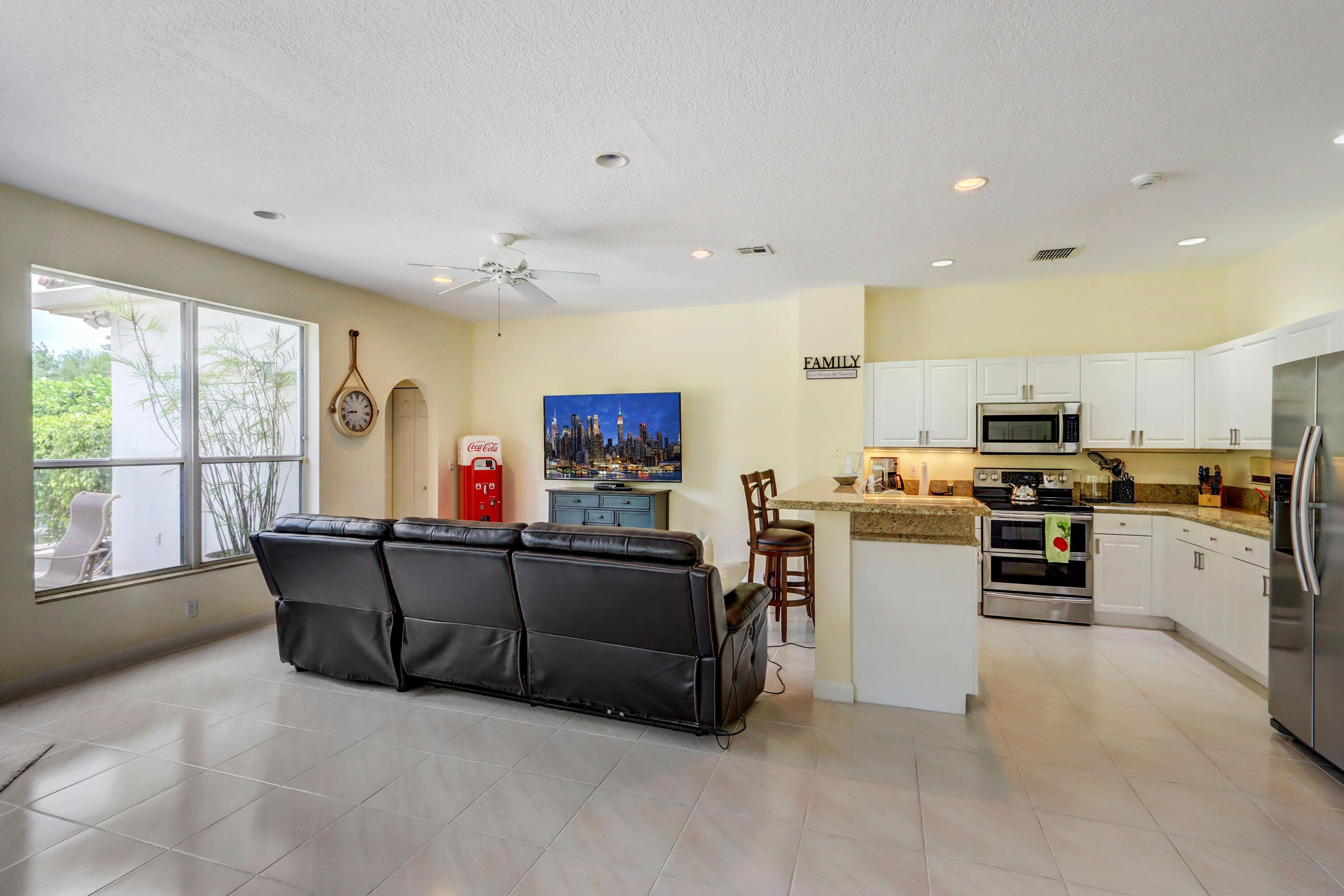 4075 Northwest 58th Lane Boca Raton, FL 33496 - Photo 11 of 24 Family Room - Kitchen