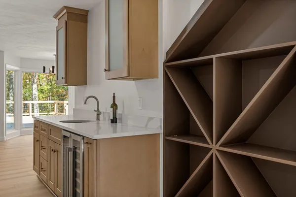 a kitchen with a sink a refrigerator and window