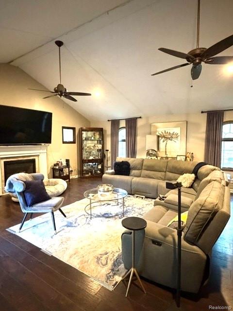 42263 Palmer Road Canton, MI 48188 - Photo 18 of 22 Spacious living area featuring vaulted ceilings, dark wood-finish flooring, and a fireplace with a white mantel