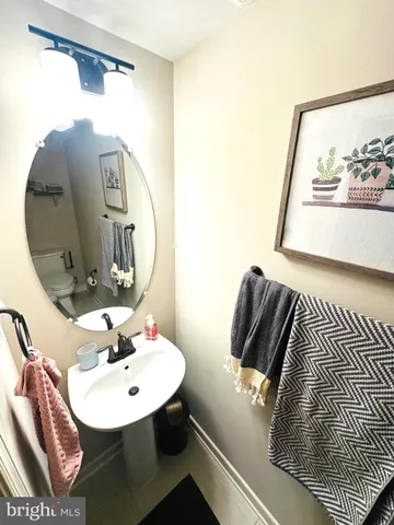 a bathroom with a sink and mirror