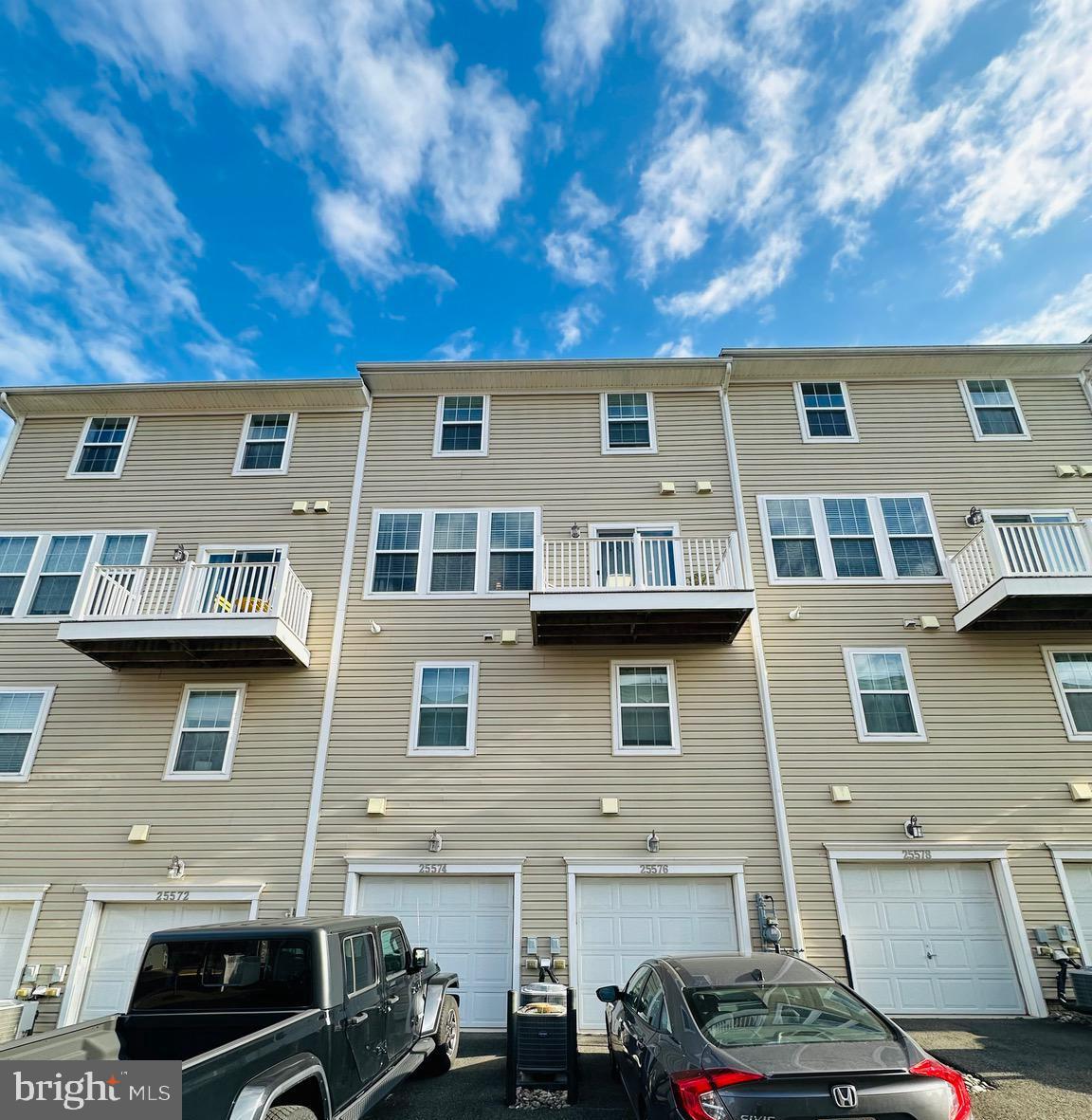 25576 Tolar Square Chantilly, VA 20152 - Photo 29 of 36 a front view of a house with a yard