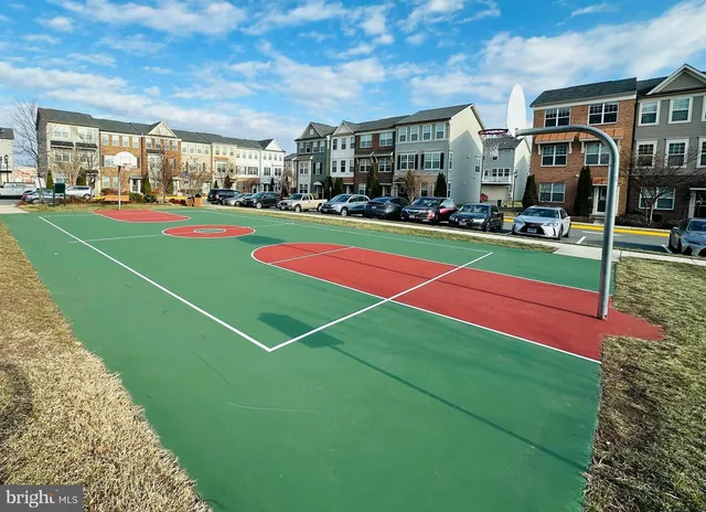 a view of swimming pool with outdoor seating and city view