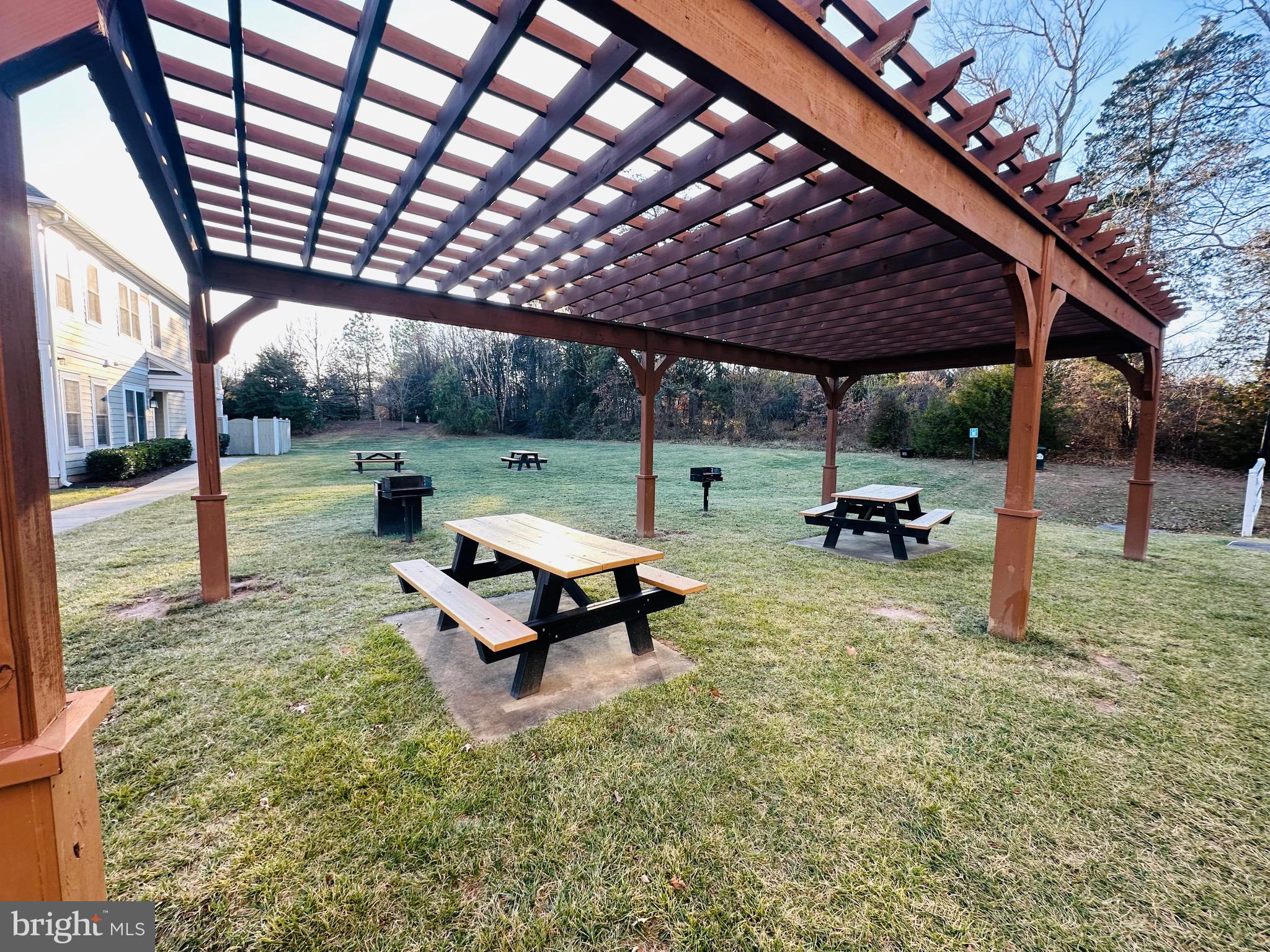 25576 Tolar Square Chantilly, VA 20152 - Photo 35 of 36 a view of a backyard with table and chairs