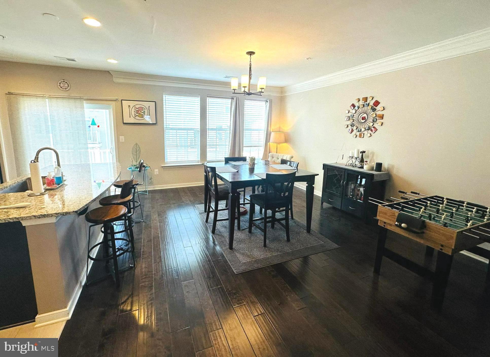 25576 Tolar Square Chantilly, VA 20152 - Photo 7 of 36 a view of a dining room with furniture window and wooden floor