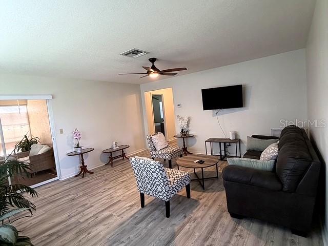 1629 Willow Run Sebring, FL 33872 - Photo 5 of 16 a living room with furniture or wooden floor and a flat screen tv