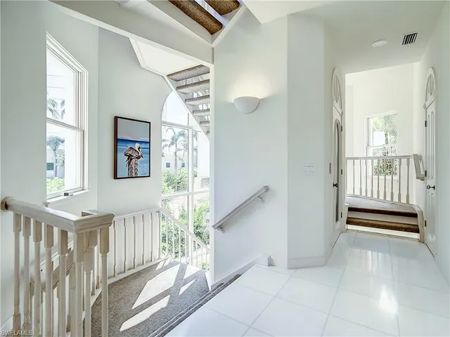 a lobby with furniture and floor