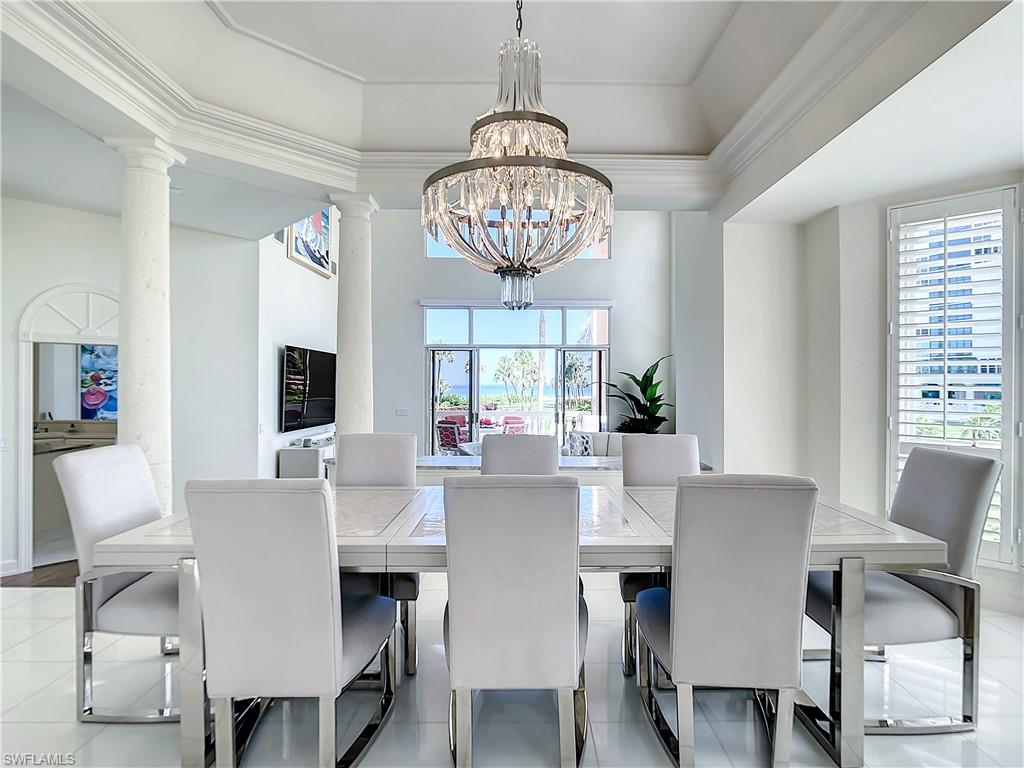 21 Casa Mar Lane, Unit 21 Naples, FL 34103 - Photo 13 of 47 a view of a dining room with furniture window and outside view